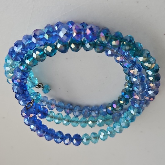 CRYSTAL AB LIGHT BLUE & MEDIUM BLUE Beads on Wire Bracelet. 2 1/2" Dia. - Picture 5 of 6